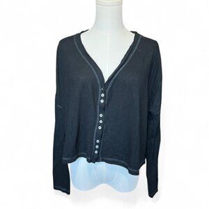 out from under black sheer long sleeve top with button front